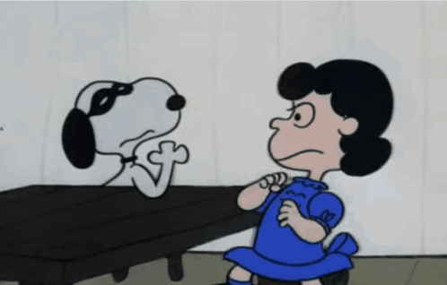 A Girl In A Blue Dress Is Standing Next To A Dog With A Mask On His Face GIF