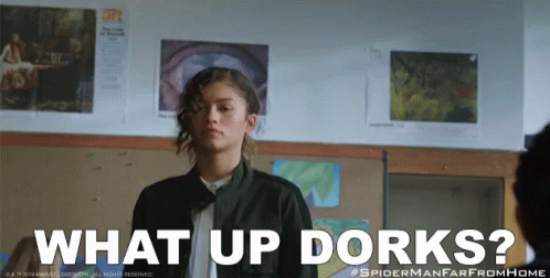 A Girl In A Classroom With The Words What Up Dorks Below Her GIF