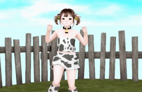A Girl In A Cow Print Outfit Stands In Front Of A Fence GIF