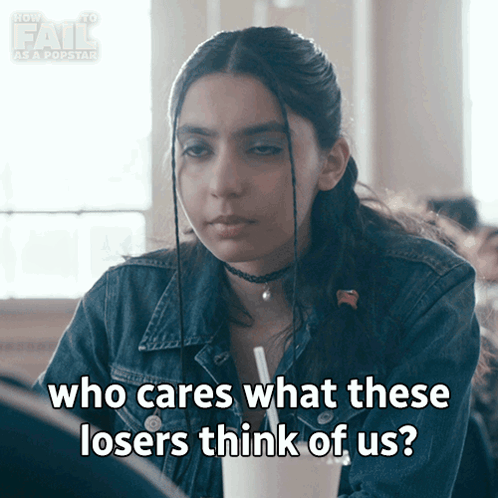 A Girl In A Denim Jacket Is Saying Who Cares What These Losers Think Of Us GIF