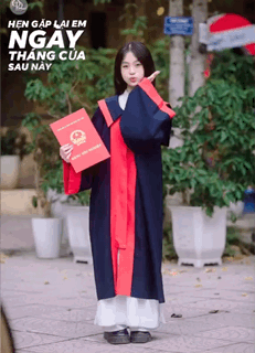 A Girl In A Graduation Gown Holds A Certificate GIF