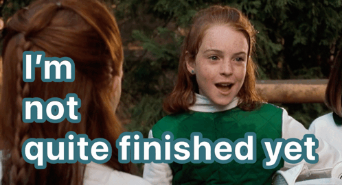 A Girl In A Green Vest With The Words I 'M Not Quite Finished Yet Above Her GIF