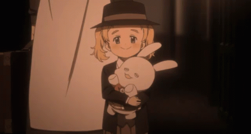 A Girl In A Hat Holds A Stuffed Rabbit GIF