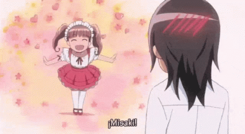 A Girl In A Maid Costume Is Standing Next To A Man . GIF