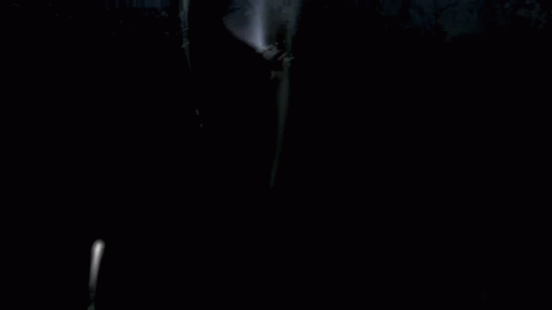 A Girl In A Maid Dress Is Standing In Front Of A Group Of People GIF