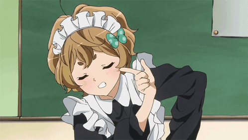 A Girl In A Maid Outfit Is Pointing To Her Face GIF