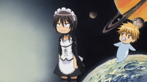 A Girl In A Maid Outfit Stands Next To A Boy In A Diaper GIF