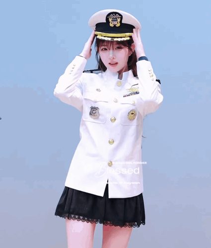 A Girl In A Military Uniform Salutes While Another Girl Walks By GIF