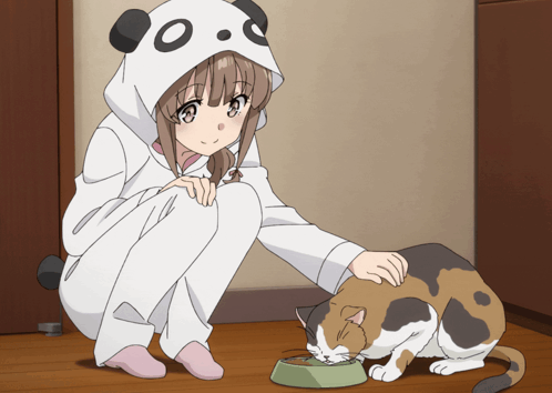 A Girl In A Panda Costume Is Petting A Cat That Is Eating Out Of A Bowl GIF