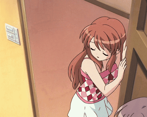 A Girl In A Pink And White Checkered Top Is Standing In A Doorway With Her Eyes Closed GIF