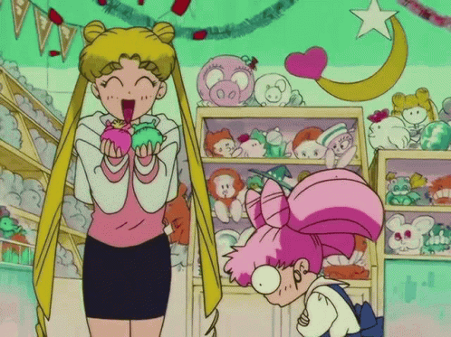 A Girl In A Pink Dress Is Standing Next To A Girl In A Pink Dress GIF