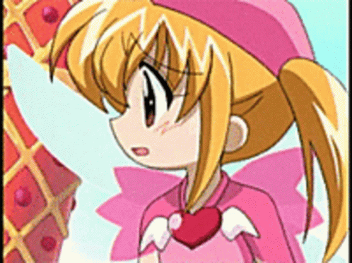 A Girl In A Pink Outfit With A Heart Around Her Neck GIF