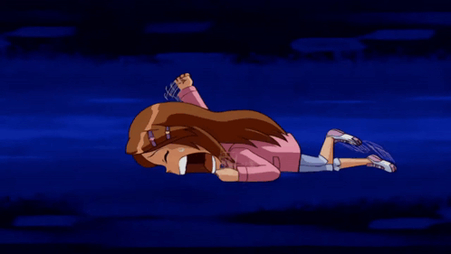 A Girl In A Pink Shirt Is Laying On Her Stomach With Her Eyes Closed GIF
