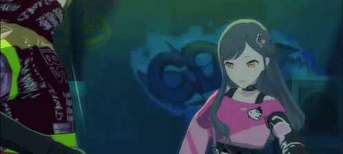 A Girl In A Pink Shirt Is Standing Next To A Man In A Purple Shirt That Says Mrc On It GIF