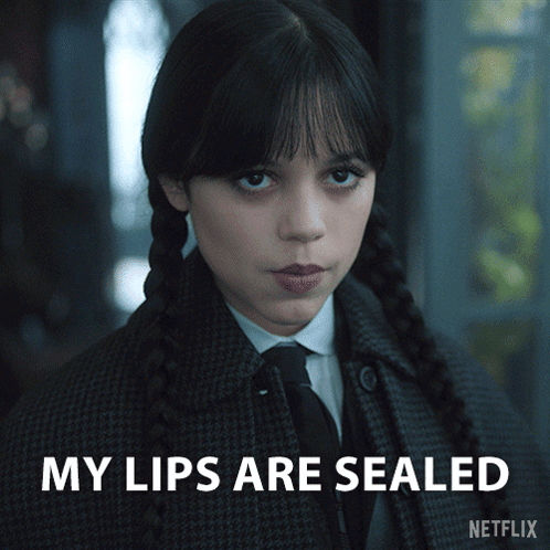 A Girl In A Plaid Coat And Tie With The Words My Lips Are Sealed On The Bottom GIF