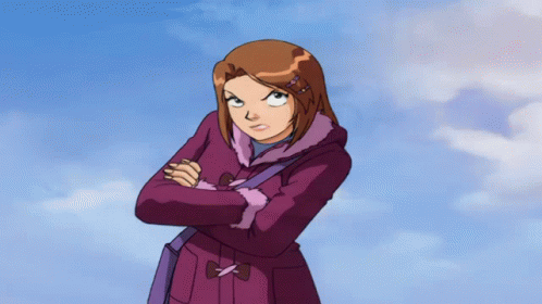 A Girl In A Purple Coat Has Her Arms Crossed And Looks Angry GIF