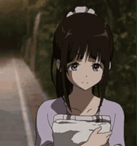 A Girl In A Purple Shirt Is Holding A Tablet In Her Hand . GIF