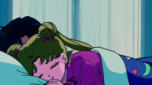 A Girl In A Purple Shirt Is Sleeping On A Bed GIF