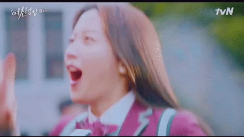 A Girl In A Purple Uniform Is Giving A High Five To Someone . GIF