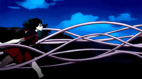 A Girl In A Red Dress Is Running Through A Bunch Of Purple Ropes GIF
