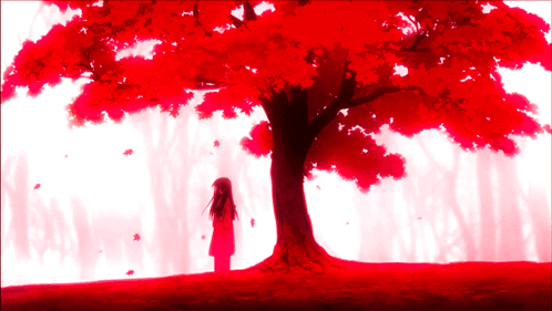 A Girl In A Red Dress Stands In Front Of A Tree With Red Leaves GIF