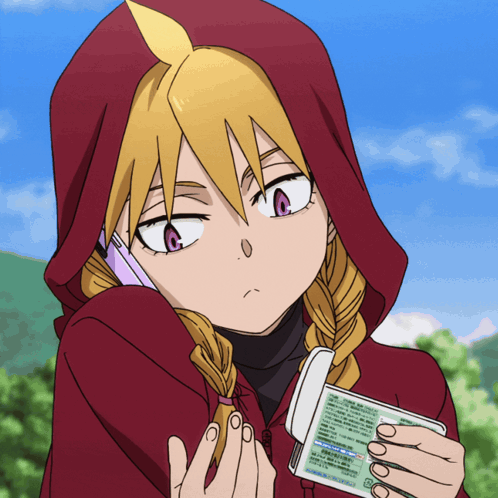 a girl in a red hoodie is talking on a cell phone while holding a passport