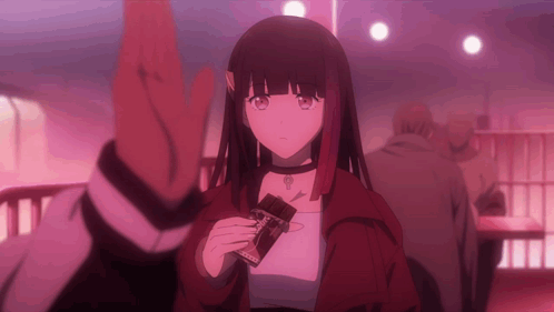 A Girl In A Red Jacket Is Holding A Chocolate Bar That Says ' Cocoa ' On It GIF