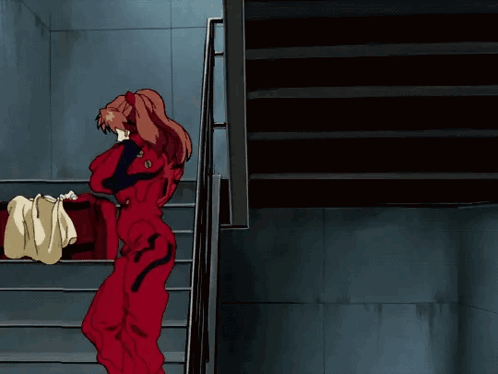 Girl In Red Jumpsuit Walking Down Stairs GIF