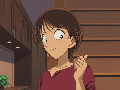 A Girl In A Red Shirt Is Pointing At Something GIF