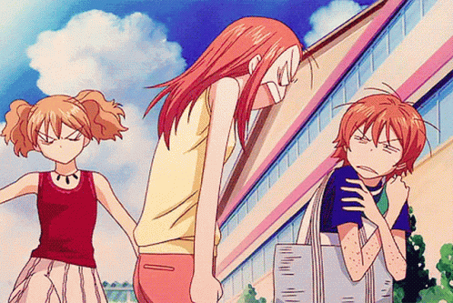 a girl in a red tank top stands next to a boy in a blue shirt