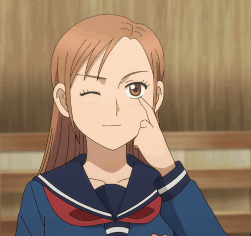 A Girl In A Sailor Suit Winks Her Eye GIF