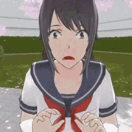 A Girl In A Sailor Uniform Is Standing On A Sidewalk In Front Of A Cherry Blossom Tree . GIF