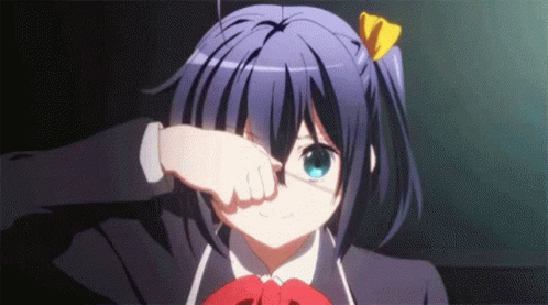 A Girl In A School Uniform Is Covering Her Eyes With Her Hand . GIF
