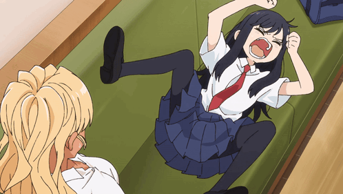 A Girl In A School Uniform Is Laying On Her Stomach With Her Mouth Open GIF