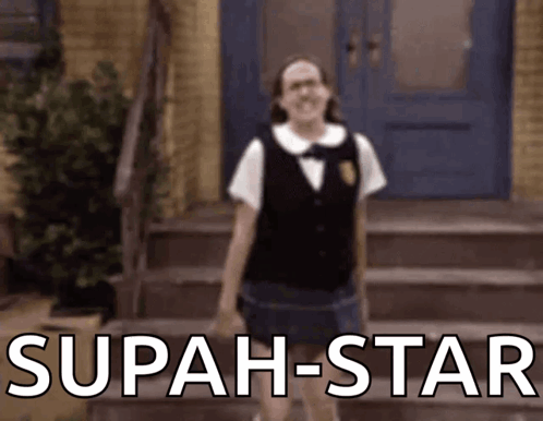 A Girl In A School Uniform Is Standing In Front Of Stairs With The Words ' Superstar ' In White Letters GIF