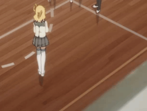 A Girl In A School Uniform Is Walking On A Wood Floor GIF