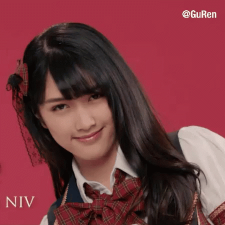 A Girl In A School Uniform With The Name Niv Written On The Bottom GIF
