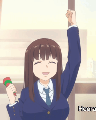 A Girl In A Suit And Tie Is Holding Her Fist Up In The Air GIF