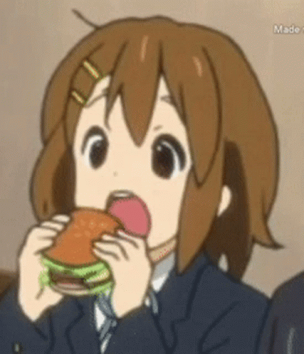 A Girl In A Suit Is Eating A Hamburger GIF
