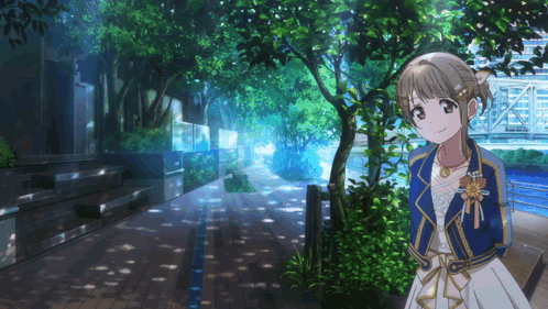 A Girl In A White Dress And A Blue Jacket Stands On A Sidewalk GIF