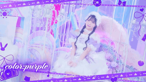 A Girl In A White Dress Is Sitting On A Bed With The Words Color Purple Behind Her GIF