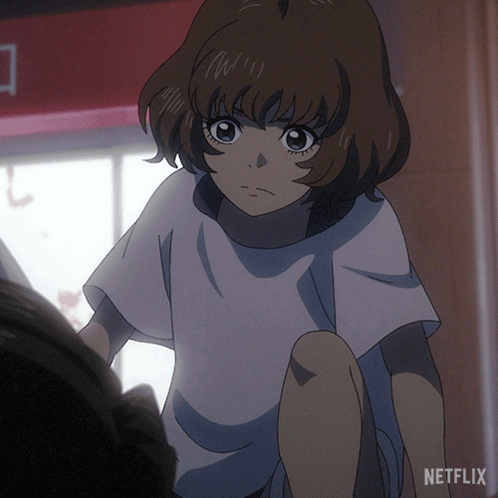 A Girl In A White T-Shirt With Netflix Written On The Bottom GIF