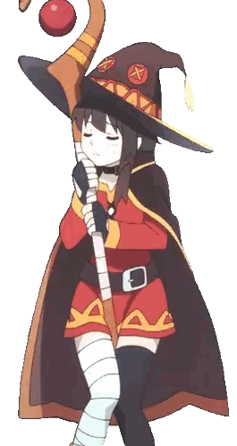 a girl in a witch costume holds a cane