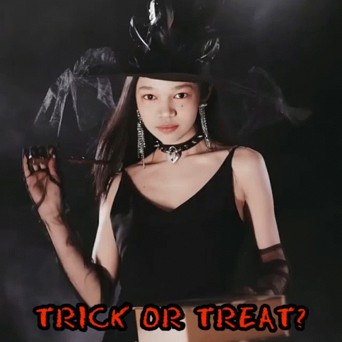 A Girl In A Witch Costume Is Holding A Flashlight And The Words Trick Or Treat Are Below Her GIF