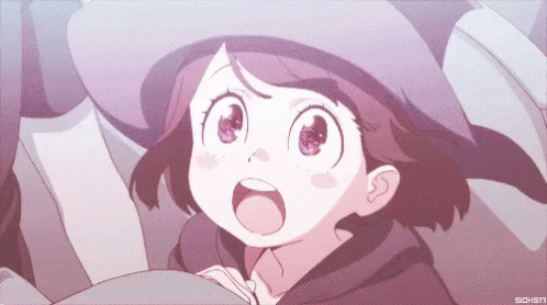 A Girl In A Witch Hat Is Looking Up With Her Mouth Wide Open GIF