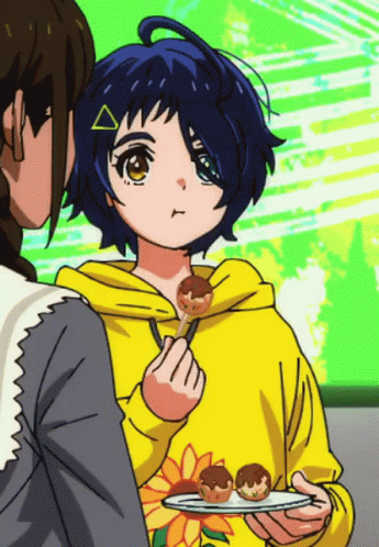 A Girl In A Yellow Hoodie Is Holding A Plate Of Food In Her Hand GIF