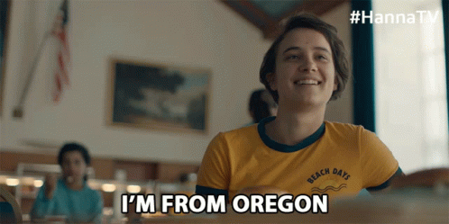 a girl in a yellow shirt with the words i 'm from oregon