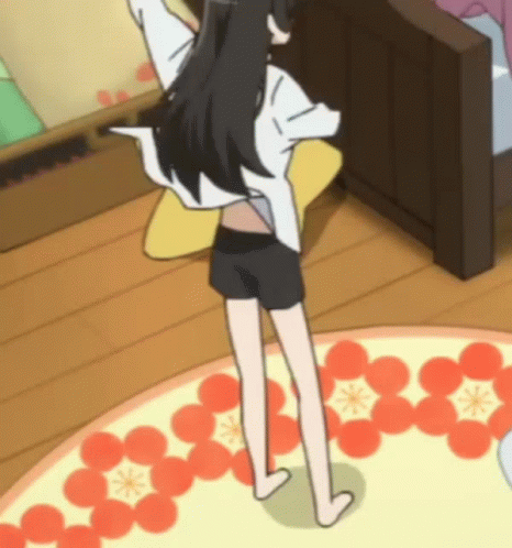 A Girl In Shorts And A White Shirt Is Standing On A Rug With Flowers On It GIF