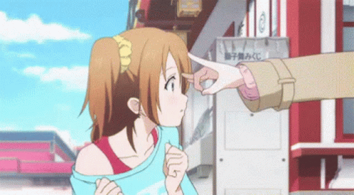 A Girl Is Being Touched By A Person 'S Hand In Front Of A Sign That Says ' A ' On It GIF