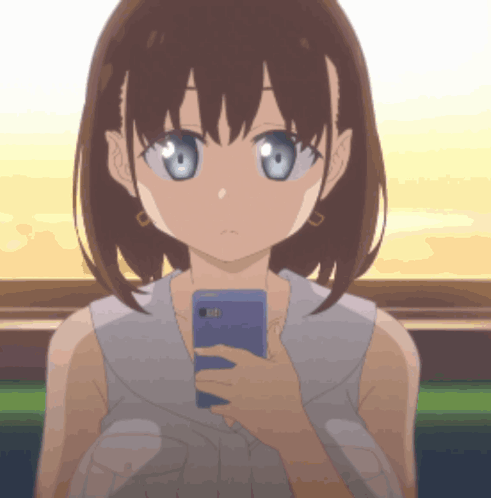A Girl Is Holding A Cell Phone In Her Hand GIF